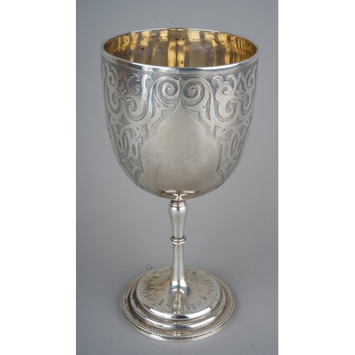 211 - A Victorian silver goblet, engraved scrolling detail, vacant cartouche, on a stepped circular base, ... 