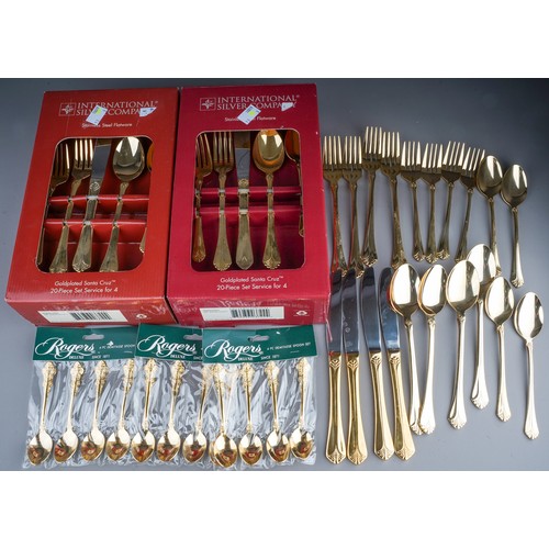 233 - Two boxed gold plated Santa Cruz 20 piece cutlery sets together with another 20 piece loose set and ... 