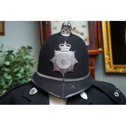 457 - Vintage Cambridgeshire police uniform including helmet, circa 1990