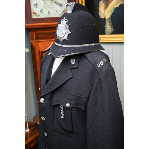 457 - Vintage Cambridgeshire police uniform including helmet, circa 1990