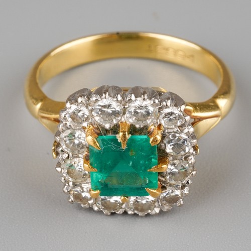 463 - An emerald and diamond square cluster ring, set with a square-cut emerald surrounded by twelve round...