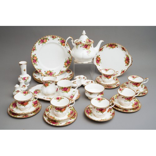 631 - Royal Albert Country Roses tea and dinner wares to include tea pot, dinner plates, trios, cake plate... 