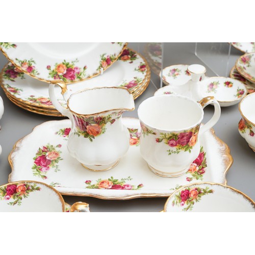 631 - Royal Albert Country Roses tea and dinner wares to include tea pot, dinner plates, trios, cake plate... 