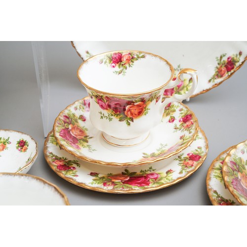 631 - Royal Albert Country Roses tea and dinner wares to include tea pot, dinner plates, trios, cake plate... 