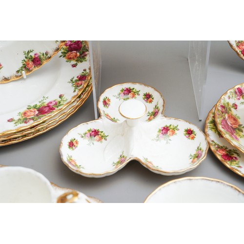 631 - Royal Albert Country Roses tea and dinner wares to include tea pot, dinner plates, trios, cake plate... 