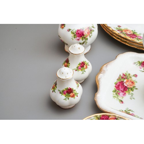 631 - Royal Albert Country Roses tea and dinner wares to include tea pot, dinner plates, trios, cake plate... 