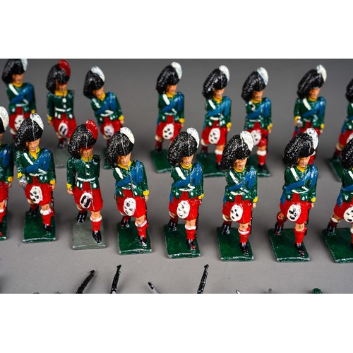 348 - Vintage Britains or similar a collection of 32 white metal Scottish Black Watch model soldiers with ... 