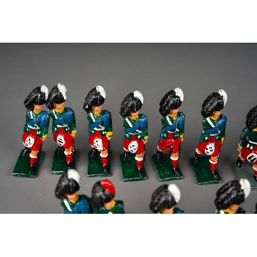 348 - Vintage Britains or similar a collection of 32 white metal Scottish Black Watch model soldiers with ... 