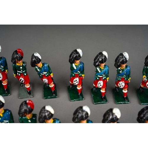 348 - Vintage Britains or similar a collection of 32 white metal Scottish Black Watch model soldiers with ... 