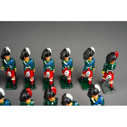 348 - Vintage Britains or similar a collection of 32 white metal Scottish Black Watch model soldiers with ... 