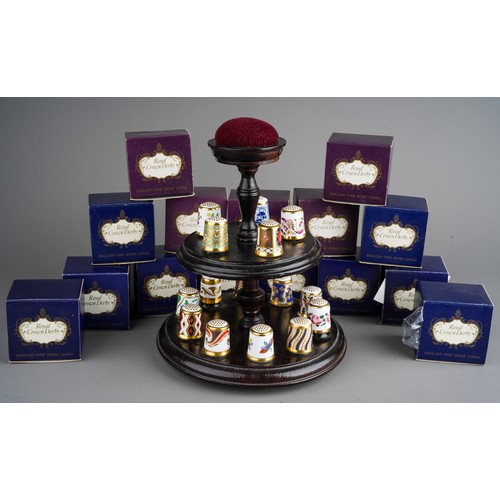 473 - A collection of  thirteen Royal Crown Derby thimbles, in numbered boxed and stand (1 bag)