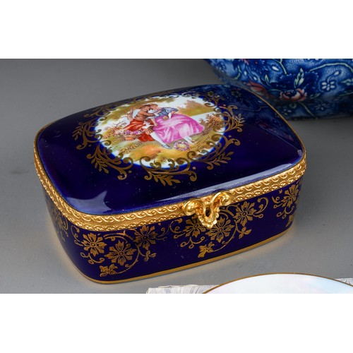 477 - A Limoges cobalt blue table snuff box and cover, the cover painted with 18th Century lovers, the bod... 