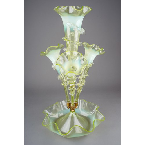 84 - A large Victorian clear and opaline ( uranium) glass epergne, the bowl with wavy rim, four trumpet s...