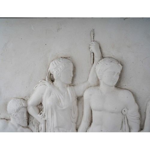 537 - A plaster panel depicting four Classical figures in relief, approx 53 x 44cm