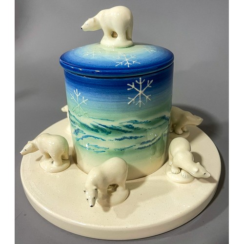 483 - A Dennis China Works preserve pot and stand,  cylindrical jar and cover with polar bear finial, the ... 