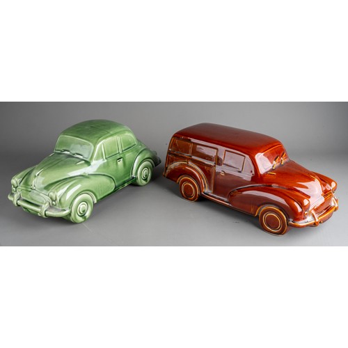 577 - A large Dartmouth style ceramic models of green Morris Minor 1000 and an amber Morris Traveller (2)