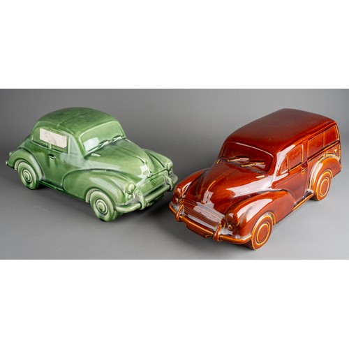 577 - A large Dartmouth style ceramic models of green Morris Minor 1000 and an amber Morris Traveller (2)