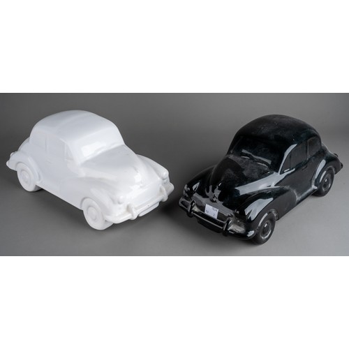 579 - Two large Dartmouth style ceramic car models to include a black and a white Morris Minor 1000 (2)