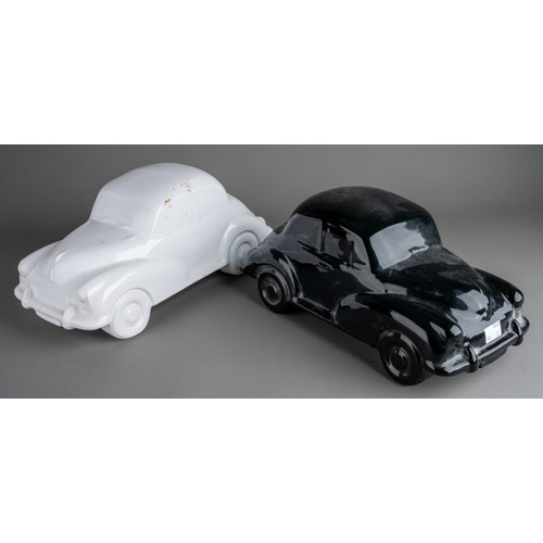 579 - Two large Dartmouth style ceramic car models to include a black and a white Morris Minor 1000 (2)