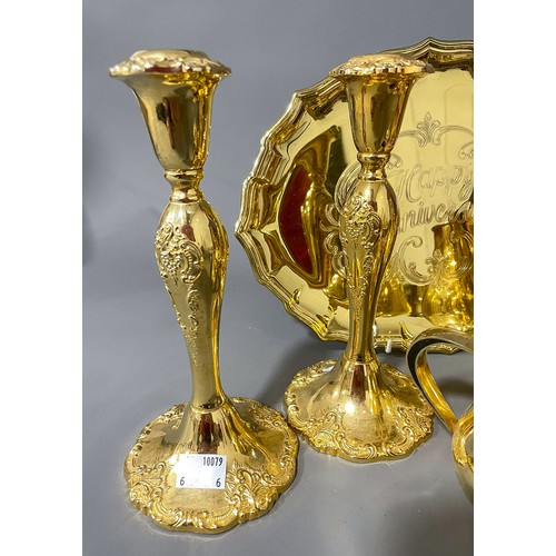 231 - A pair of gilt metal candlesticks and a gilt metal tea set with matching Happy Anniversary tray and ... 