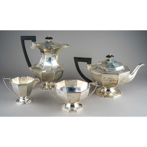 203 - A George VI silver four piece tea service comprising teapot, milk jug, sugar bowl and hot water pot,... 