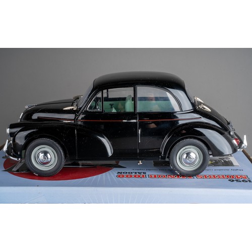 583 - Toys: a boxed Sun Star die-cast 1:12 scale replica model of a 1956 Morris Minor 1000, boxed in packa... 