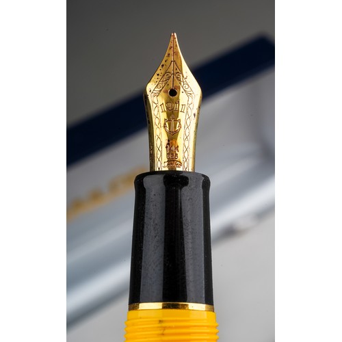 359 - A group of three Japanese Sailor fountain pens in yellow, purple or red, all with 14k white or yello... 