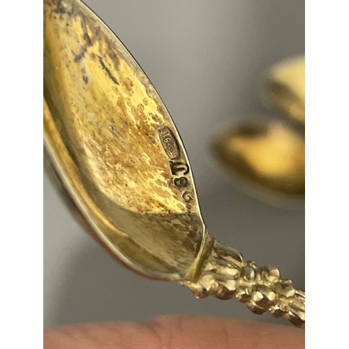 234 - A set of four Russian 916 standard silver gilt ornate coffee spoons, the bowls stamped, gross weight... 