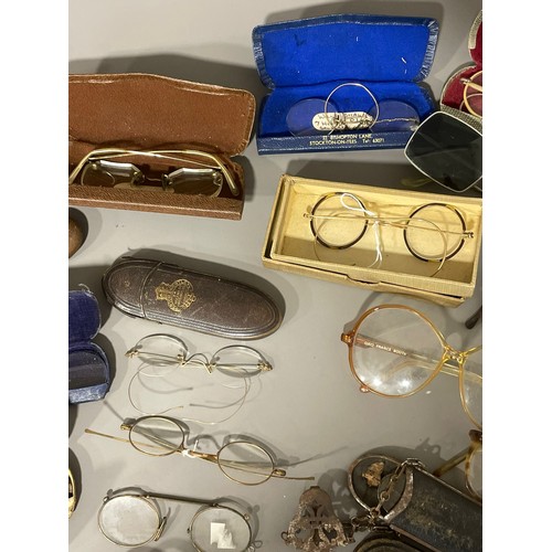 85 - A collection of various vintage spectacles and glasses, some gold