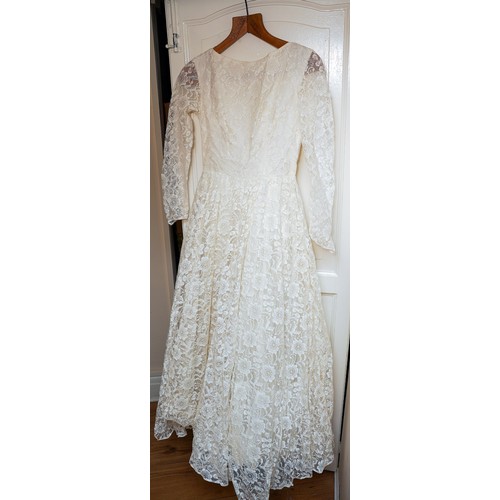 192 - A 1960s full lace ankle length small size wedding dress, full skirt with tulle together a box of sho... 