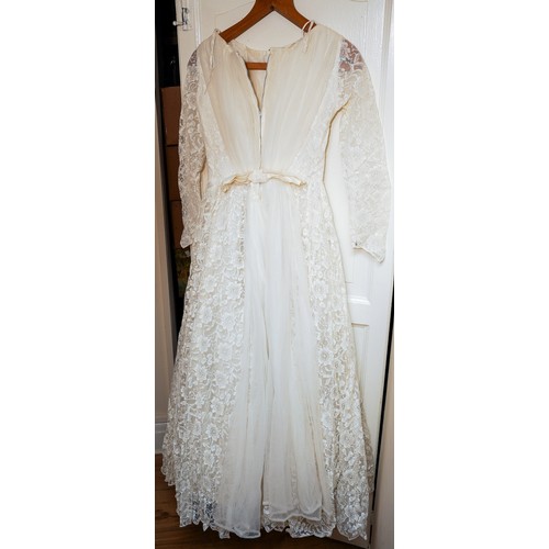 192 - A 1960s full lace ankle length small size wedding dress, full skirt with tulle together a box of sho... 