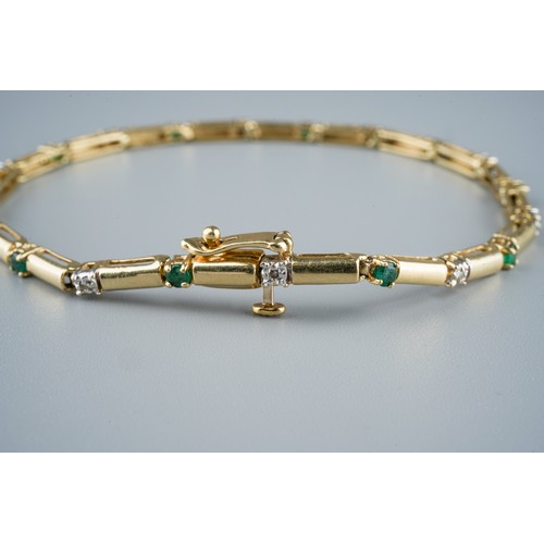 26 - A 14ct gold emerald and diamond bracelet, each rectangular link alternatively divided by a diamond a... 