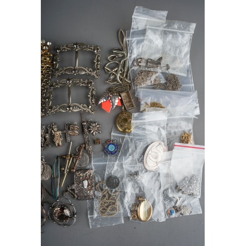 111 - A collection of silver and white metal jewellery, including chains, watch chains, brooches, pendants... 