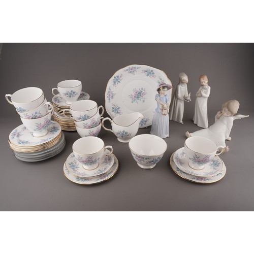 487 - A collection of ceramics to include: Lladro 6487 Girl with shoe boxes; Nao girl with puppy; Lladro g... 