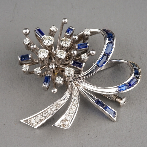 3 - A 14k white gold diamond and sapphire brooch,  set with round-cut diamonds and calibre-cut sapphires... 