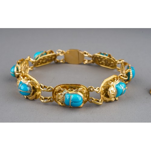 5 - An Egyptian yellow gold bracelet, with seven scarab beetle links set with turquoise glass, approx 18... 