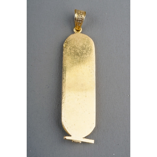 6 - An Egyptian yellow gold pendant, cast with hieroglyphics, control mark to back, approx 5.2cm long, g... 