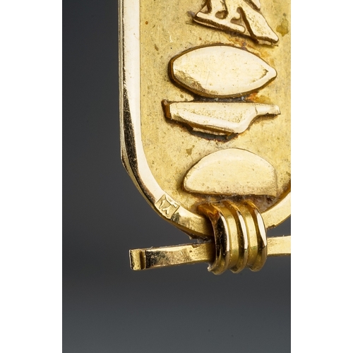 6 - An Egyptian yellow gold pendant, cast with hieroglyphics, control mark to back, approx 5.2cm long, g... 