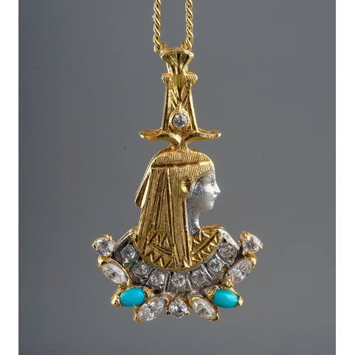 8 - An Egyptian yellow metal and paste pendant necklace, cast as a pharoah with paste and turquoise colo... 