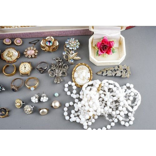 12 - A collection of costume, including brooches, earrings, faux pearls, Art Deco, football medals, marca... 