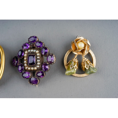 17 - A Georgian yellow metal paste and seed pearl brooch, set with oval amethyst glass and a border of se... 