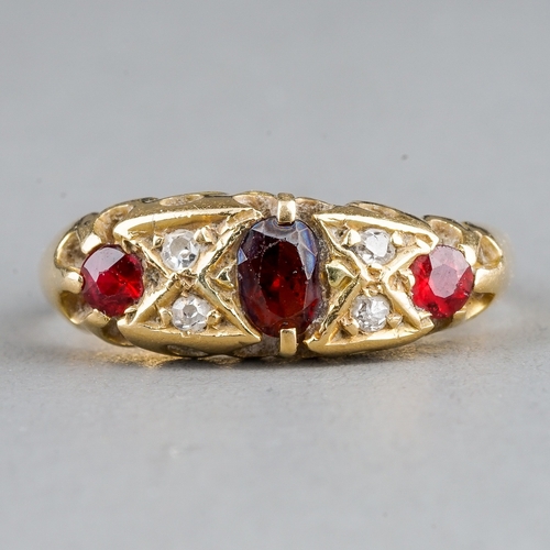 19 - An Edwardian 18ct yellow gold garnet and diamond ring, size N1/2, hallmarked Chester 1909, gross wei... 