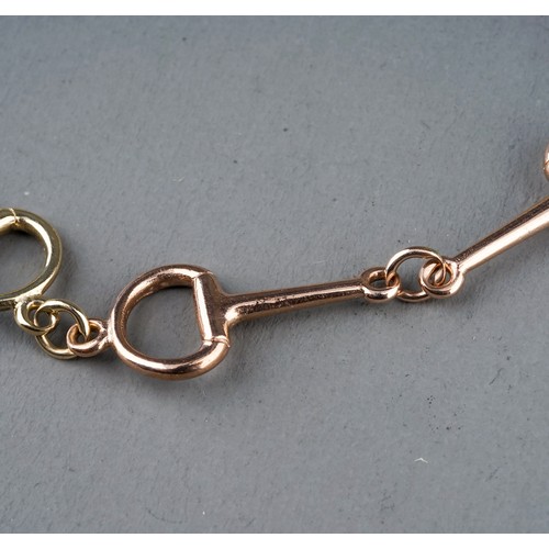 22 - A 9ct yellow and rose gold snaffle bit bracelet, approx 20cm long, gross weight approx 6.2g