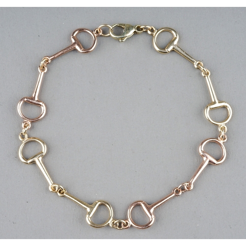 22 - A 9ct yellow and rose gold snaffle bit bracelet, approx 20cm long, gross weight approx 6.2g