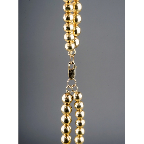 24 - A yellow gold double strand necklace, two rows of beads, the larger approx 7mm the smaller approx 6.... 