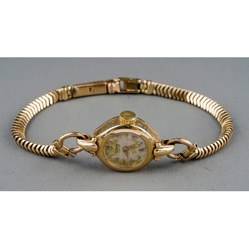 25 - A 9ct yellow gold ladies Rotary wristwatch, circular dial, on a 9ct gold snake-link bracelet strap, ... 