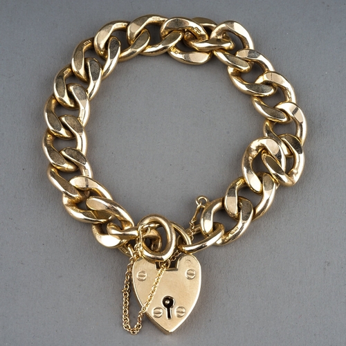 26 - A 9ct yellow gold heavy gauge flat curb-link bracelet, padlock clasp, total gross weight approx 47.6... 