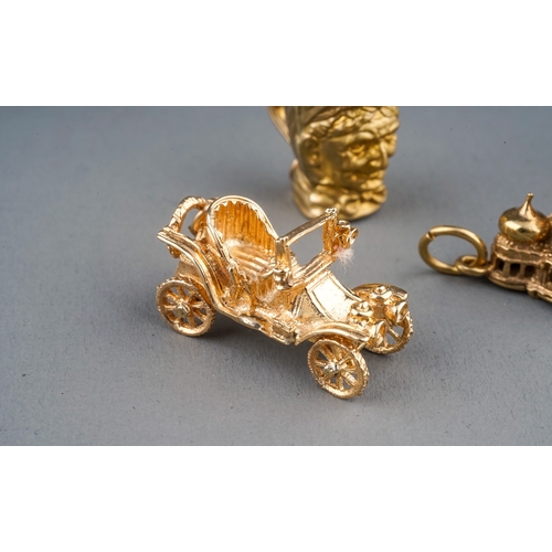 30 - Five 9ct yellow gold charms, including motor car, wagon, Brighton Pavillion, Toby jug and an oil lam... 