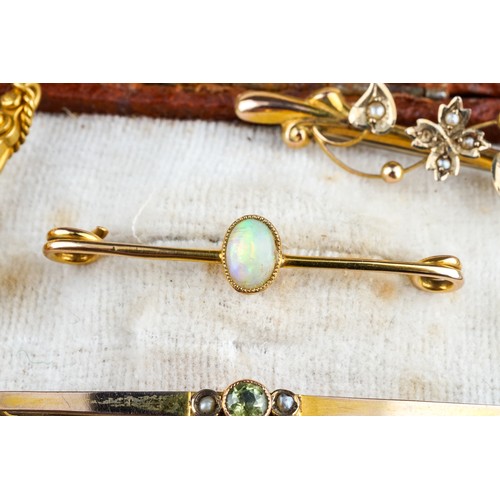 31 - A collection of four Edwardian 9ct yellow gold bar brooches, including seed pearl, opal, peridot, to... 