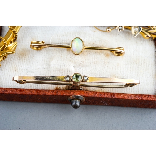 31 - A collection of four Edwardian 9ct yellow gold bar brooches, including seed pearl, opal, peridot, to... 